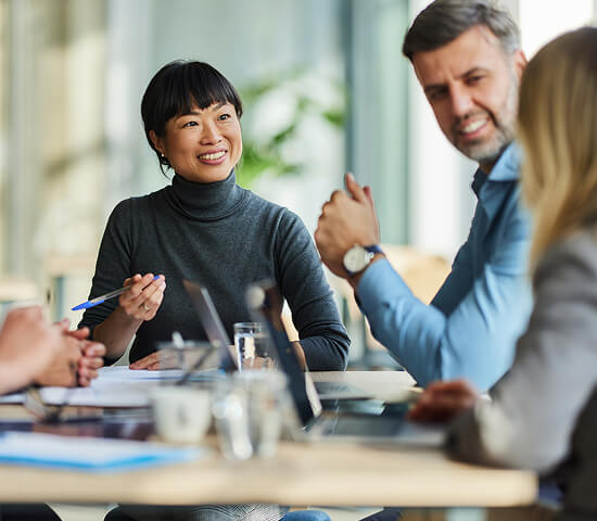 smiling teammates in conversation