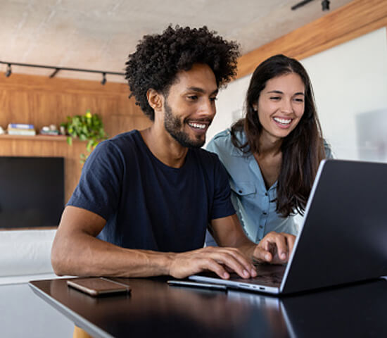 couple using laptop