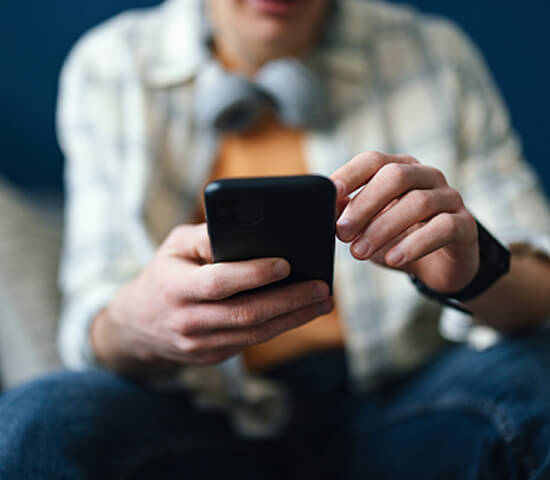 man with mobile phone in hand